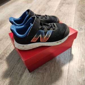 New Balance Kids' Black Sneakers with Blue Lining and Orange Logo - 9.5 Wide